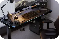 Height-adjustable standing gaming desk with ergonomic edge design