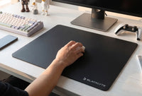 Glass Mousepads: The Physics of Near-Zero Friction Tracking