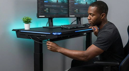 Gamer routing cables into a gaming desk's built-in cable tray — clean cable management for a tidy setup