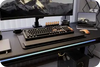 Height-adjustable standing gaming desk with ergonomic edge design